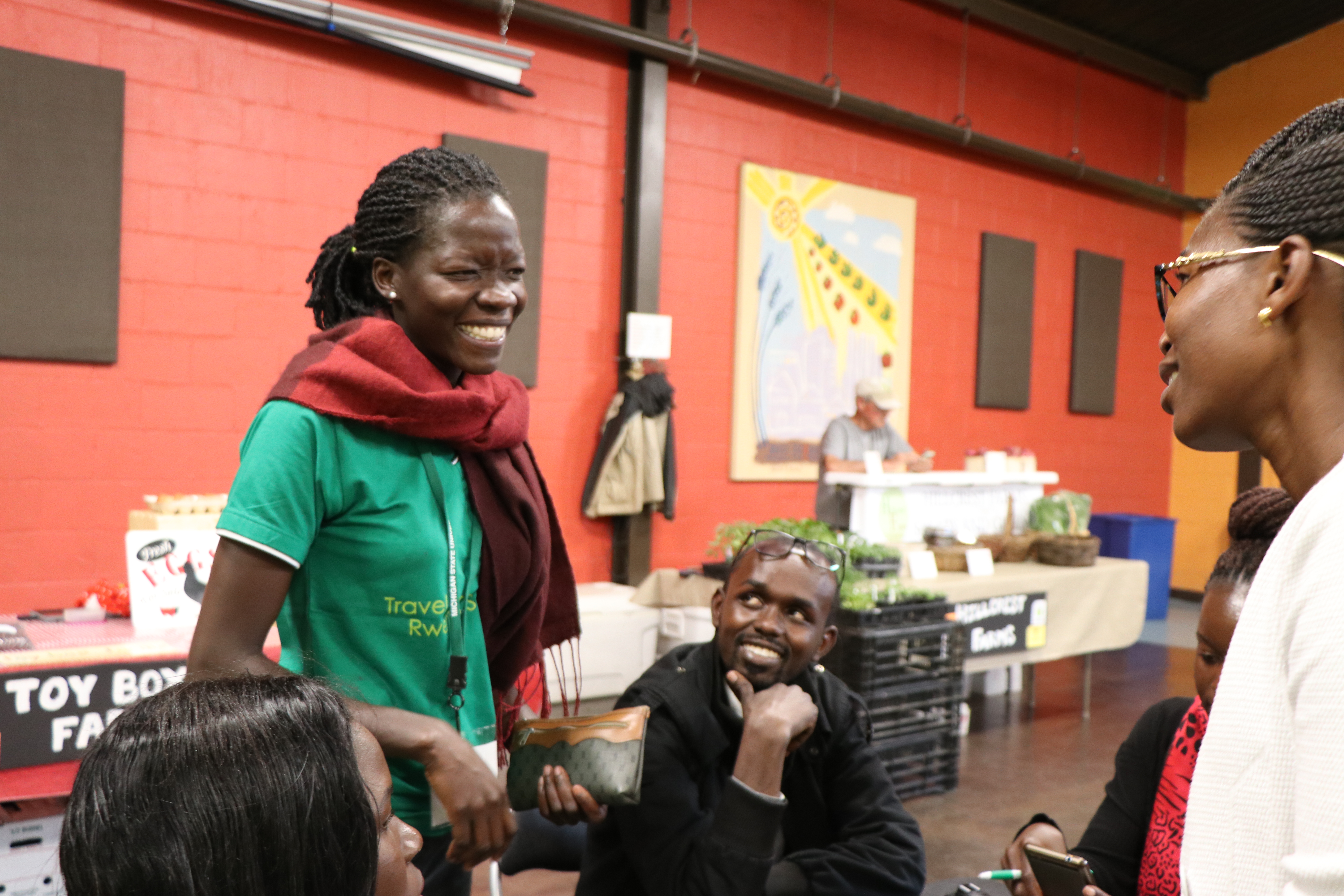 Eudine Awuzu Asara with friends at Allen Farmers Market